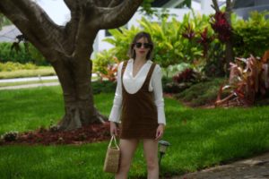 Alba Marina fashion blogger of Mylovelypeople blog is wearing a mini dress jumper + white blouse and cowboys boots in Miami