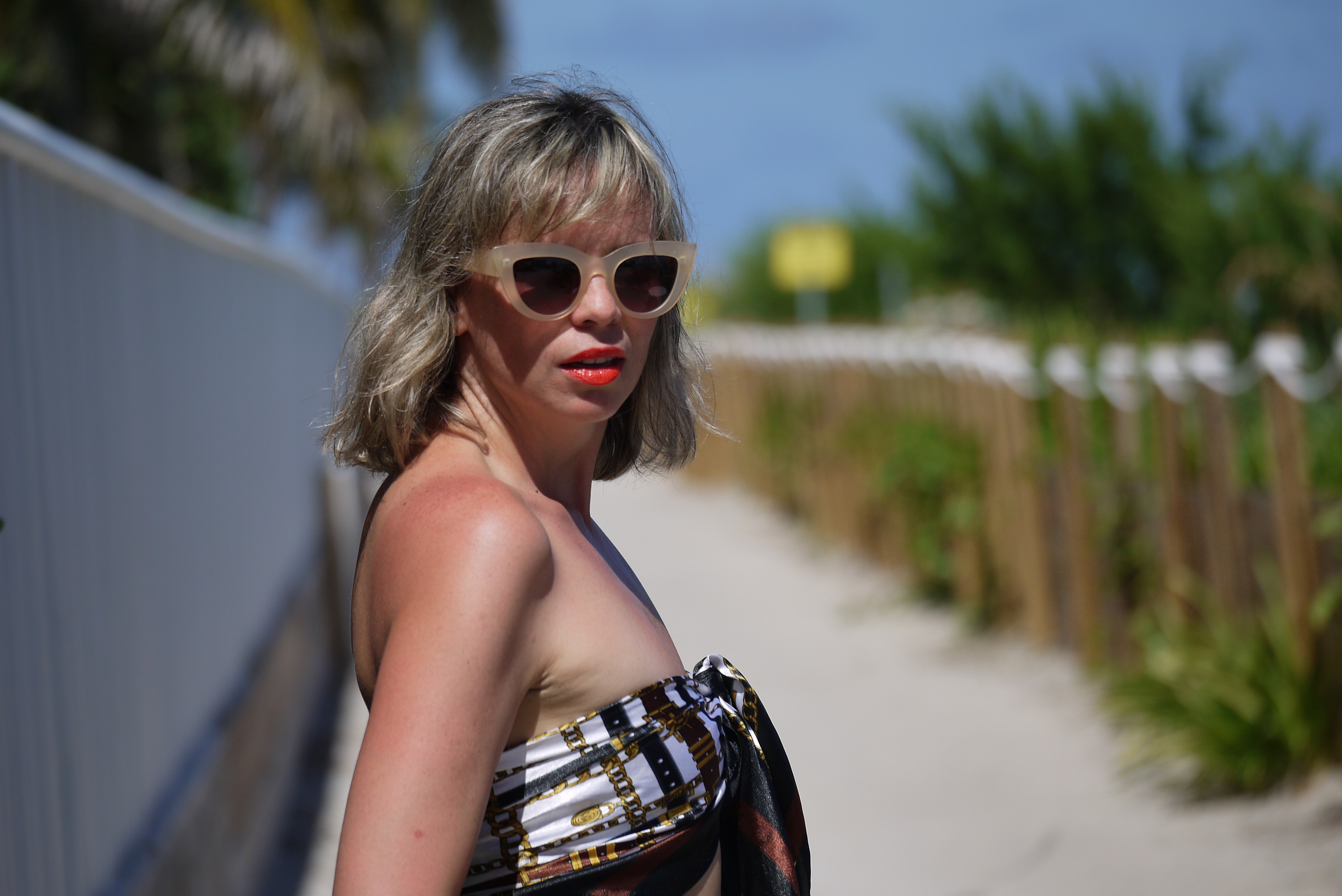 Alba Marina Otero fashion blogger from Mylovelypeople blog shares with you what to wear in a birthday party at the beach, she is wearing a high waist polka dots pants, a scarf as a top and a pairs of flat greek sandals